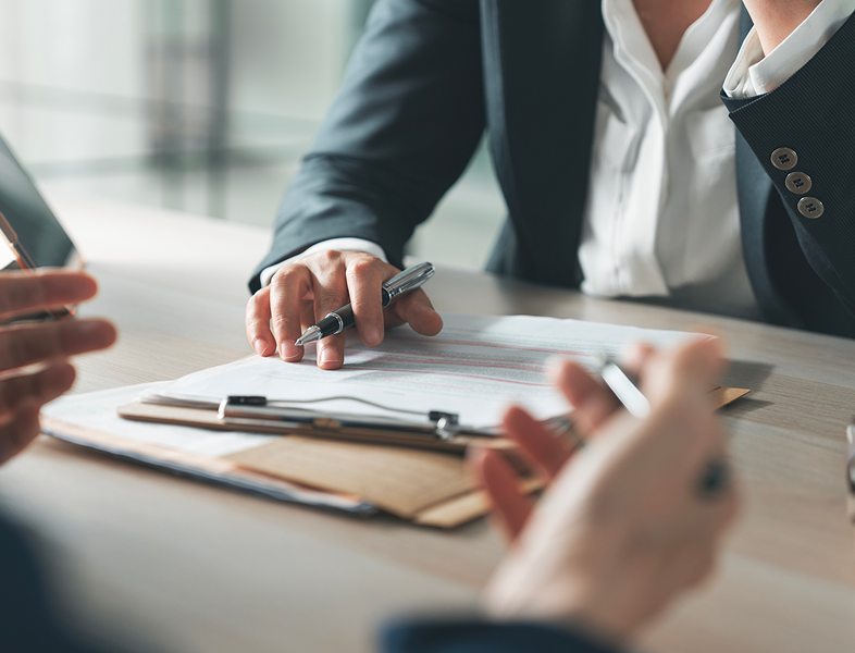 Business meeting with documents and pens